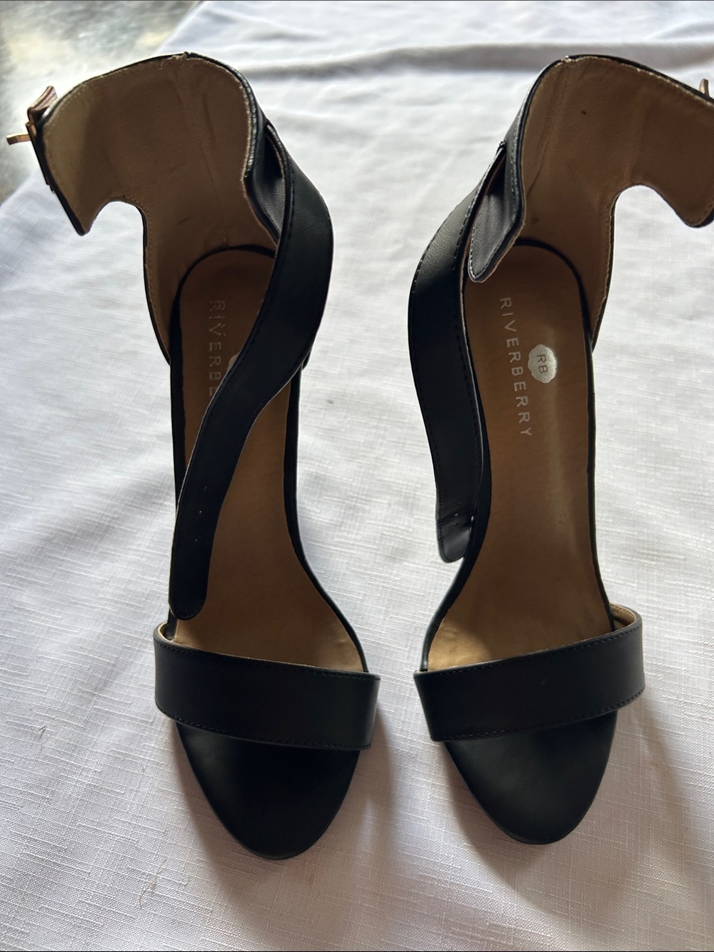 Black Open-Toe Ankle-Strap Heels have a little peel check the picture
